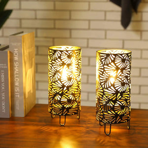 9-inch high black metal lamps set of 2 with leaf-pattern cages, battery-powered, warm light.