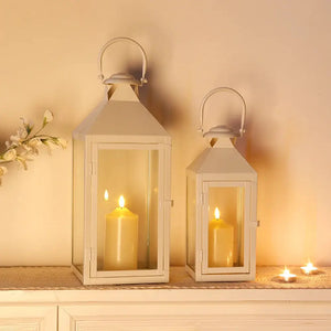 Set of 2 white metal candle lanterns with glass panels for vintage-style home decor