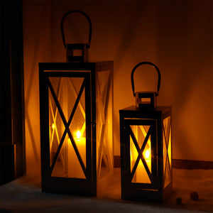 JHY DESIGN rustic metal decorative candle lanterns, set of 2, black with glass panels, 17.5 and 24.5 in, lit candles.
