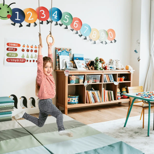 Goodevas 3in1 Swing Set with wooden gym rings hanging from rope in a child’s playroom