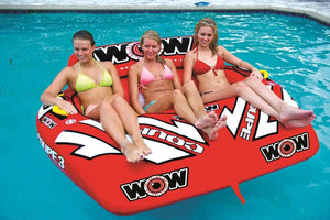 WOW Watersports 3-Person Coupe Cockpit Towable red inflatable with three riders in a pool