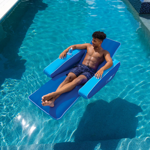 WOW Watersports Modern Lounger pool float in blue with cupholder, person relaxing in pool.