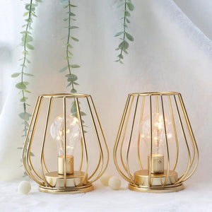 7-inch tall gold metal cage cordless table lanterns by JHY DESIGN, set of 2 with exposed bulbs.