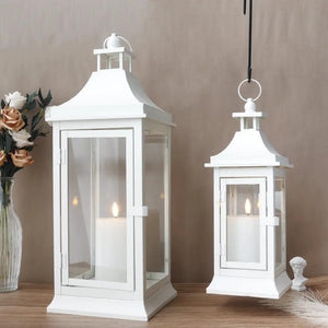 Outdoor candle lanterns set by JHY DESIGN, white metal frames with glass panels, 19.5in and 13in tall.