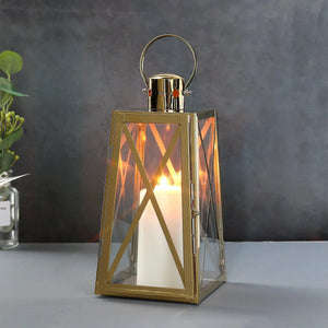 12''H Stainless Steel Decorative Lantern (Trapezoid) by JHY DESIGN with gold finish and glass panels.