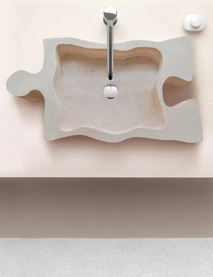 Bathroom stone sink beige travertine, puzzle-shape above vanity by Villohome