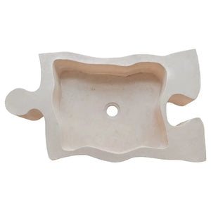 Travertine bathroom sink by Villohome, natural beige stone with puzzle-edge above-vanity design