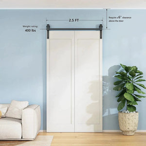 HAUSVITA bi-folding sliding barn door hardware track kit installed above white double cabinet doors on a blue wall