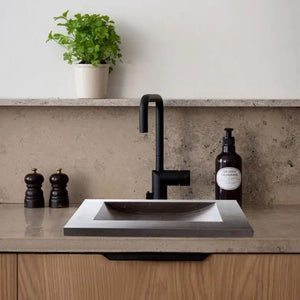 Black Andesite rectangular bathroom sink with honed matte finish.