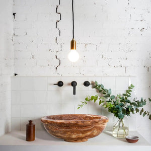 Brown onyx translucent vessel sink by Villohome; polished natural stone bathroom sink