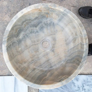 Stone sink, round above-counter vanity vessel in bubble gray translucent onyx with layered bands.