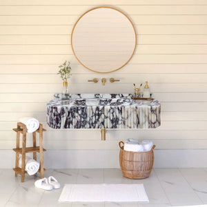 Villohome Calacatta Viola marble vessel sink with ribbed front, wall-mounted with gold fixtures and round mirror