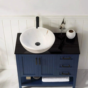 Calacatta white marble vessel sink by Villohome; rough exterior, 16in diameter