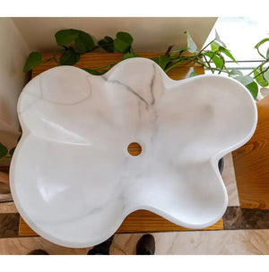 Vessel bathroom sink in Carrara white marble, flower-shaped bowl with polished finish