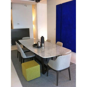 Marble dining table, rectangular with eased edge, polished white marble with gray veining; seats six.