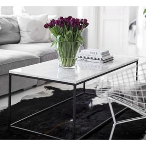Marble coffee table with rectangular polished top and eased edge, black metal frame