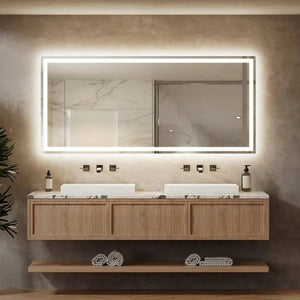 Deluxe Center Glow LED bathroom mirror with edge-lit frame over a marble countertop and wooden double-sink vanity.
