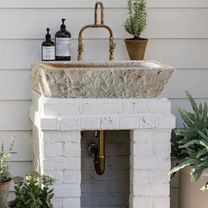 Ephesus Light Travertine rustic outdoor wall-mount sink by Villohome, stone vessel with copper faucet