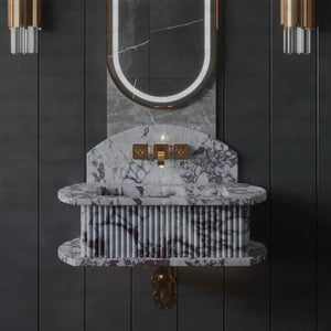 Floating wall-mount fluted marble vessel sink in white with purple veining and gold fixtures.