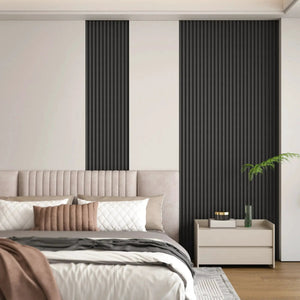 Hausvita WPC slat wall panels, black, 48x6 in, two pieces on beige bedroom wall.