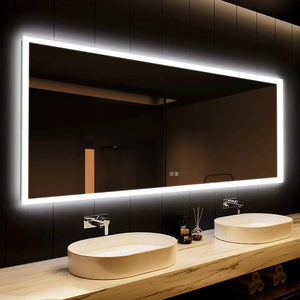 Hausvita Deluxe Edge Glow LED bathroom mirror with illuminated edge above a double-sink vanity and two vessel sinks.