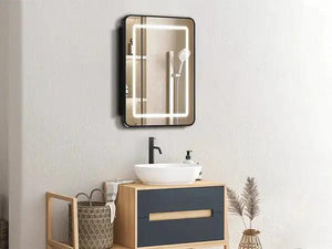 Hausvita framed recessed LED medicine cabinet with black frame and illuminated mirror above bathroom vanity.