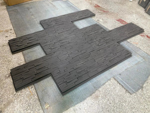 Hausvita faux stone wall siding panels in charcoal PU stone veneer exterior, 46.46 by 13 inches, set of multiple panels.