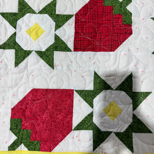 Strawberry Table Runner Kit by Block Party Quilt Co; red strawberry blocks with green leaves on white background