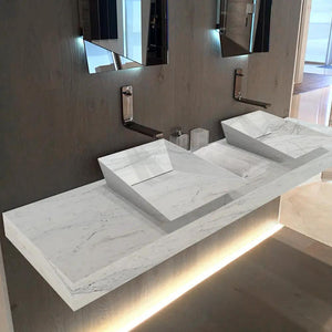 Imperial white marble double sink above vanity with wall-mounted faucets