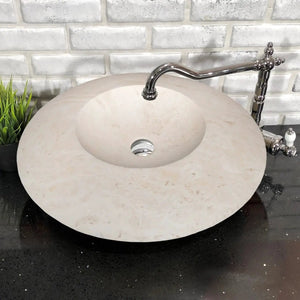 Stone sink, light travertine, UFO-shaped round bathroom vanity with chrome faucet.