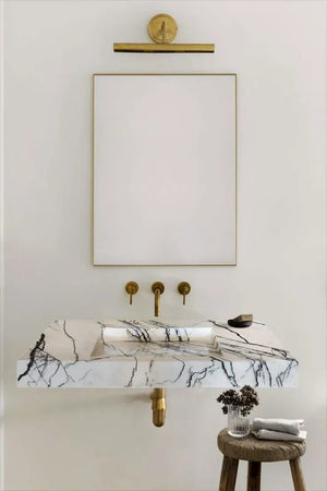 New York Marble wall-mount bathroom sink by Villohome; white marble with brass fixtures and hidden drain