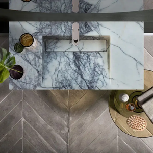 New York Marble Wall-mount Bathroom Sink with Drain Cap; white marble with dark gray veining.