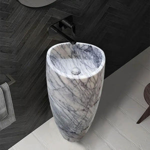 New York Marble Designer Pedestal Sink with gray-veined marble and a black faucet