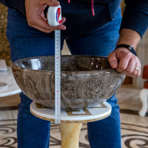 Narcist brown natural stone marble vessel sink, high-gloss finish, 16in diameter, 6in height, shown with tape measure.