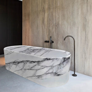 New York Marble Bathtub, hand-carved solid marble block, white with dramatic dark veining, freestanding tub