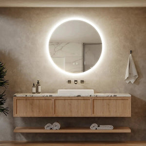 HAUSVITA round LED bathroom vanity mirror with dimmable lights above a marble countertop.
