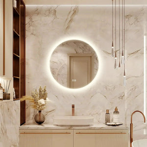 Round HAUSVITA LED bathroom vanity mirror with dimmable lights mounted on marble wall.