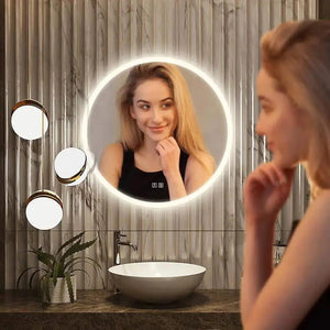 HAUSVITA round LED bathroom vanity mirror with dimmable lights on marble wall, three small circular mirrors nearby