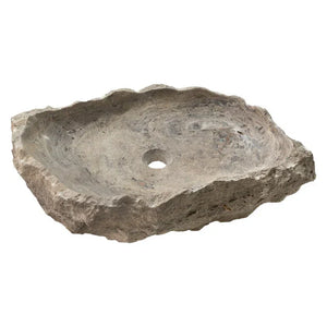 Stone sink in silver travertine with a rustic, irregular basin and central drain.