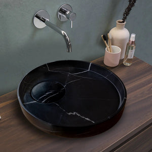 Toros black marble vanity sink, round vessel with white veining on wood counter