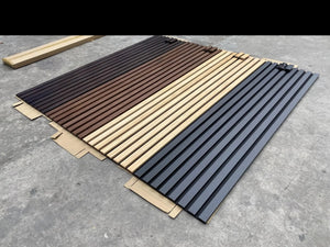 HAUSVITA Solid Wood Acoustic Slat Wall Panels (Broad Strip) in dark, brown, natural and gray finishes laid on the floor.