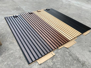 HAUSVITA solid wood acoustic slat wall panels (Broad Strip) sample bundle in dark gray, brown, natural wood, and black.
