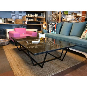 Marble coffee table, rectangular top with polished black metal legs; modern living-room centerpiece