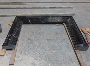 Toros Black Marble fireplace mantel, hand-carved and polished with white veining.