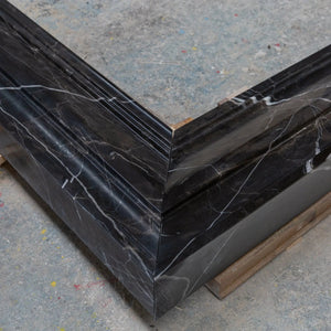 Toros black marble fireplace mantel by Villohome, hand-carved and polished with white veining.