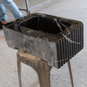 Toros black marble rectangular wall-mount bathroom sink with a polished finish and white veining.