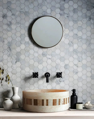 Troia Light travertine cylindrical above-vanity bathroom sink with 2-inch embedded mosaic border.