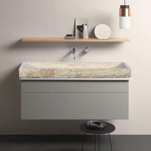 Troia Light Travertine rectangular split-face bathroom sink atop a wall-mounted grey vanity with wood shelf