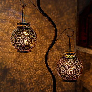 Set of 2 Moroccan-style metal table lamps by JHY DESIGN, battery-operated, with intricate perforated pattern and warm glow.