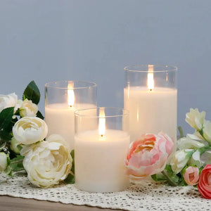 Glass flameless LED candle set of 3 in clear cylinders with warm glow